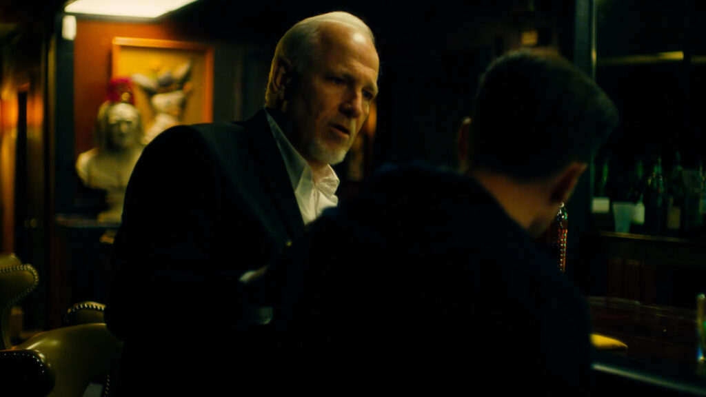 Cinematic dialogue scene filmed in low light interior during narrative video production