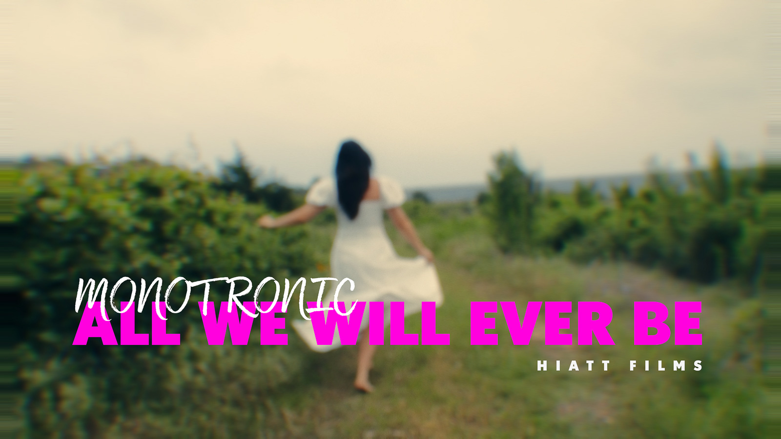 Music video thumbnail showing a woman walking through a lush outdoor landscape